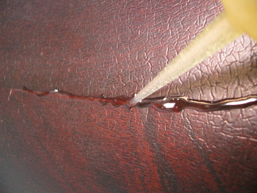 Epoxy applied to the crack through a syringe.