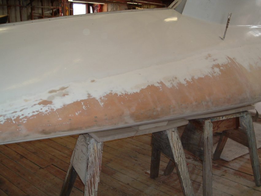 Photo B: The bottom paint sanded off ADAGIO in preparation for fairing the bottom.