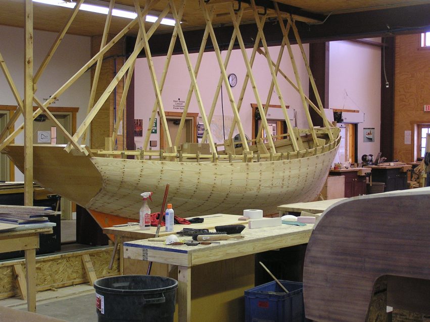 The upright build is a Harry Bryan design named Katie. First-year Great Lakes Boatbuilding School students begin by learning to build using a “right-side up” technique.