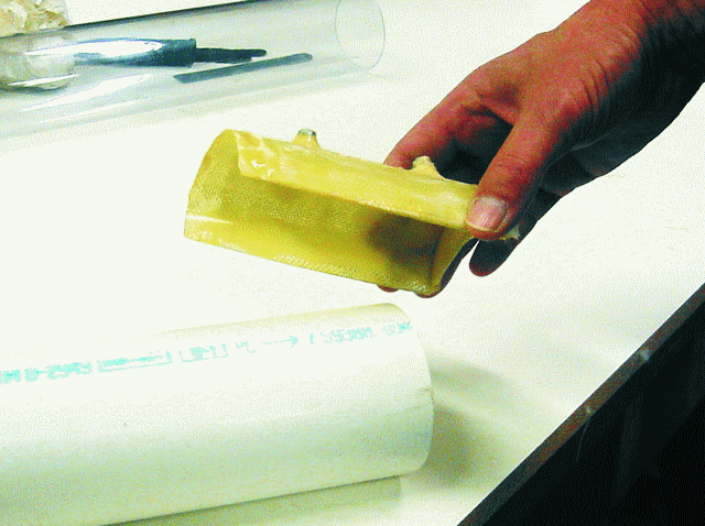 Create a positioning fixture by laminating several layers of fabric over the part to be machined. Use mold release, tape or plastic wrap to protect the part. Glue the drill bushing in position with G/5 Five-Minute Adhesive