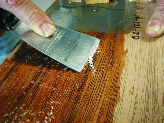 The putty knife scraper used as a push scraper.