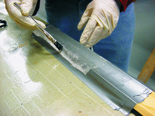 G/5 is great when you want to make shop tools quickly. 1. Laminate several layers of glass over the profile using the object to be sanded as a mold. Duct tape acts as a mold release and a spacer for the thickness of sandpaper.