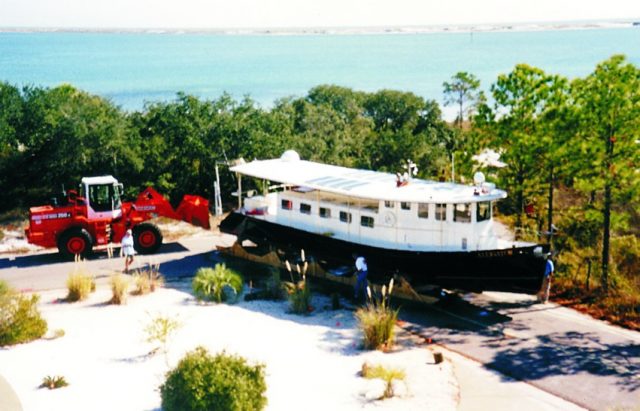 After 5 1/2 years of construction, the Biloxi lugger Alligator is moved, with help of some heavy equipment, from the building shed to her launching site.