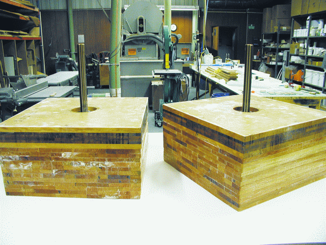 The 1 1/2" diameter silicon bronze bolt test samples before the test. In these samples, the rods were embedded perpendicular to the glue joints. The top six lamination represent Scheherazade's outer skin over a heavy laminated frame.