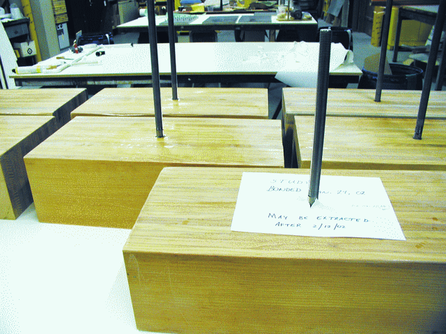 The ¾” diameter stainless steel bolt test samples before the test of large bonded-in fasteners. In these samples, the rods were embedded parallel to the glue joints. (Although the boat’s hardware will be fastened with bolts, for the tests we used threaded rods of the same diameter and material.)