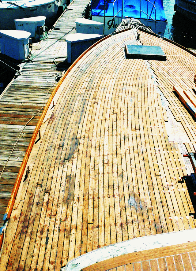 The port foredeck with all of the planks bonded in place. Dealing with the curvature reduced the number of planks that we could bond in a 30-minute interval.