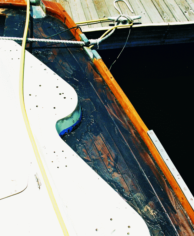 After the screws and washers were removed, the screw holes and groves were filled with epoxy/404/graphite mixture.