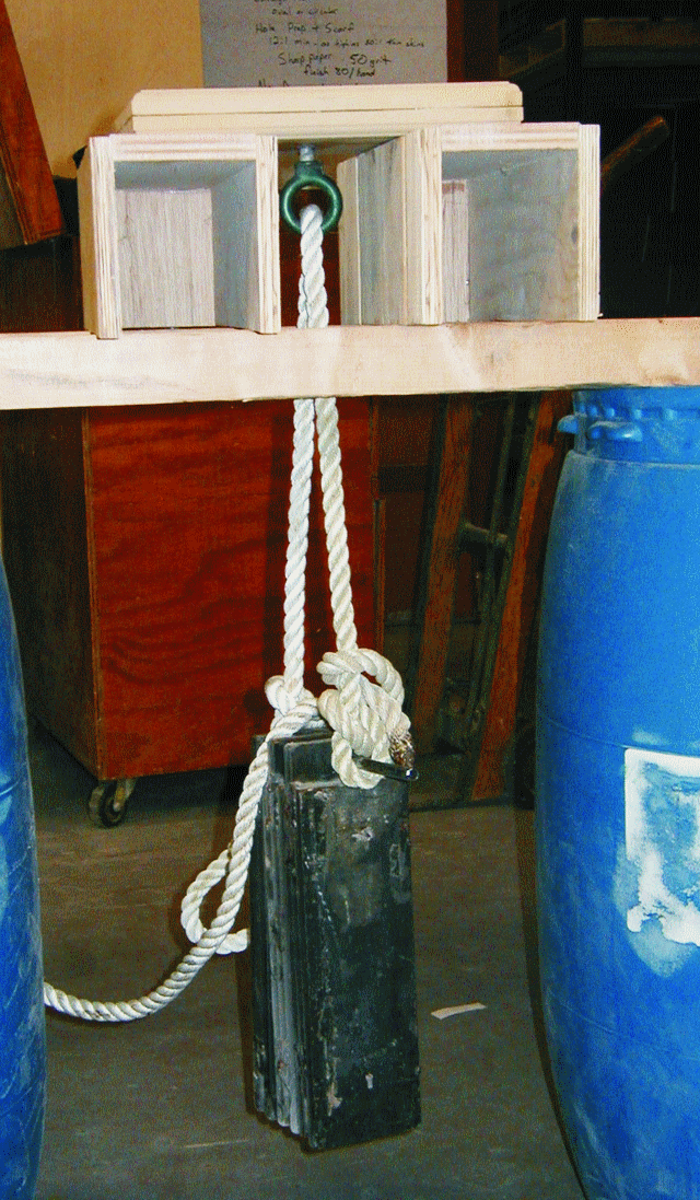 Bruce built a support system and hung weights from the eyebolt, beginning with 60 lb and working up to a 100 lb load, It was the little sample that would not fail.