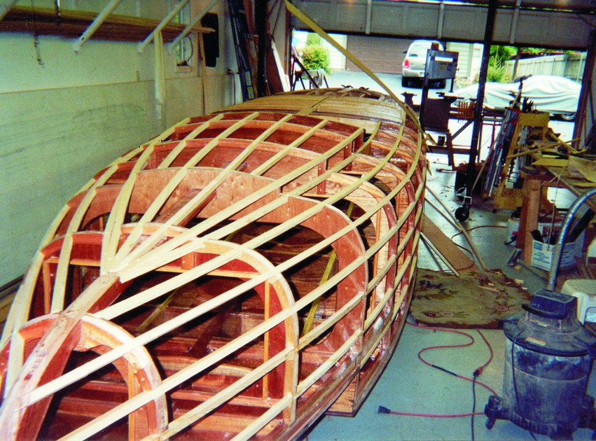 After the hatches and their frames were constructed, the topsides were ready for planking.