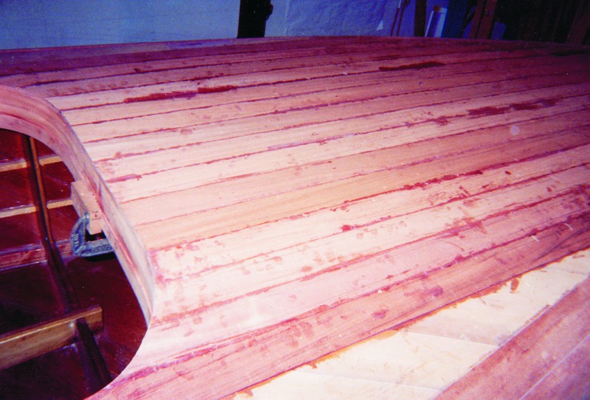 The final planking layer was 1/8" African mahogany. The total project consumed some 60,000 staples of which 55,000 were pulled after the epoxy was set.