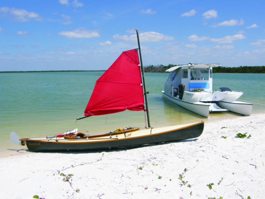 One of the sailing canoes beached near the Gougmaran. The Gougmaran's fold-down ramp allows for easy access to the beach and launch of the canoes.