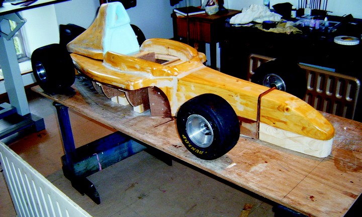 The scale model Ferrari's plug was designed to come apart in sections. Epoxy/fiberglass body parts were laid up directly on the plug sections, then assembled and faired