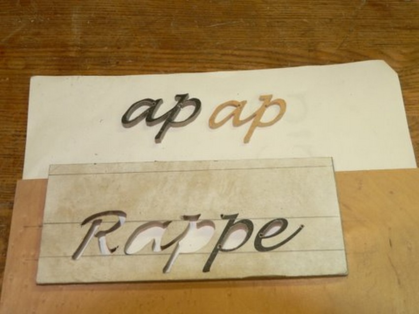 The "ap" has been cut out with the two layers separated.