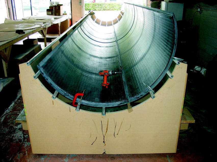 Finished panels being prepped for final assembly. The first panel joint was held in place with Cleco fasteners onto a stringer after the sheet metal had been removed.