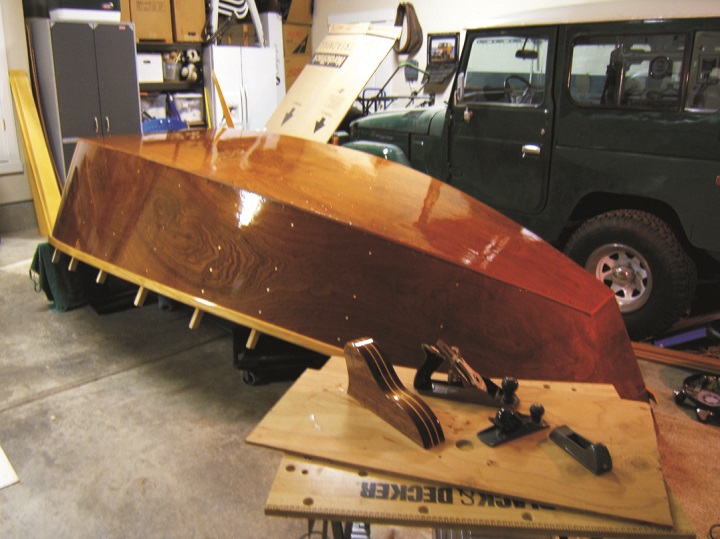 The drift boat is close to completion in the normal setting for boat building.