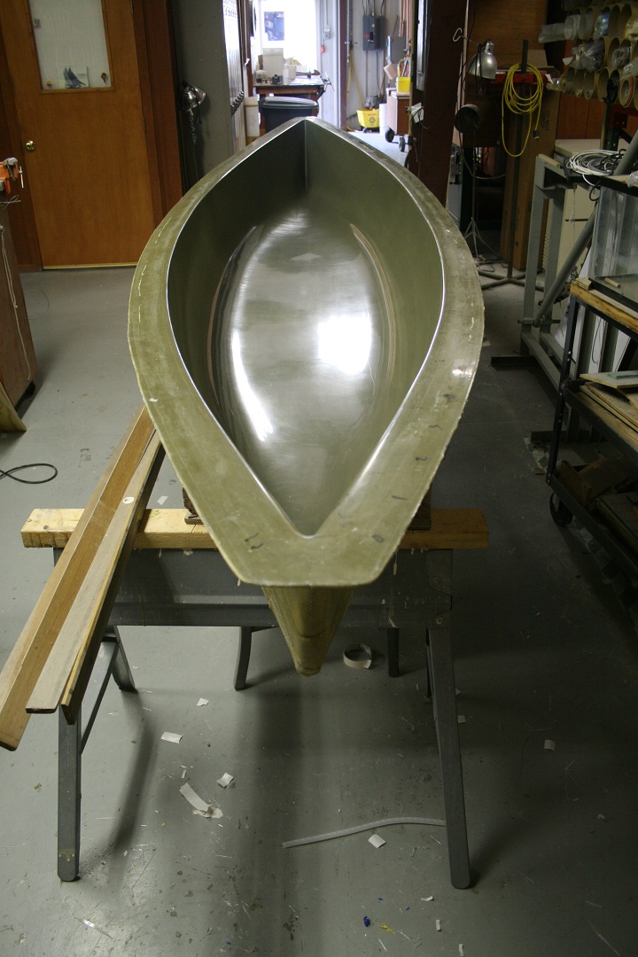 The venerable Gougeon 12.3 canoe mold. The mold surface is epoxy/404 High-Density Filler/420 Aluminum Powder. It is backed by progressively heavier layers of glass, totaling 1/4" thick.