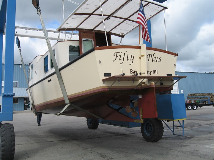 Fifty Plus is pulled from the water after her second season. The arc bottom and skeg are inspected after a quick power wash and she is ready for winter storage.