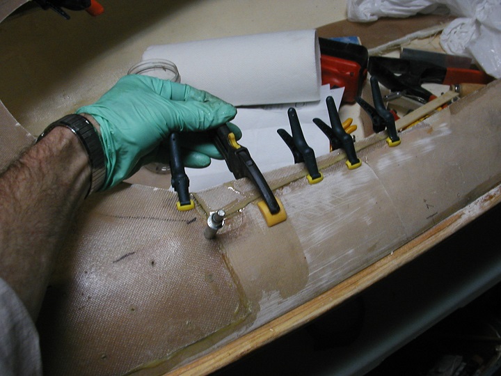 Fiberglass panels, molded from the turn of the bilge area, became the deck along each side of the cockpit.
