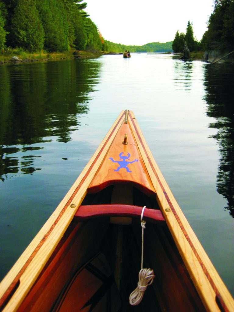 The 16’ Prospector, late in a day that saw rain and more rain. The deck is a piece of cherry, nicely sculpted, with an image of a mystical creature often seen in petroglyphs in northern Ontario.