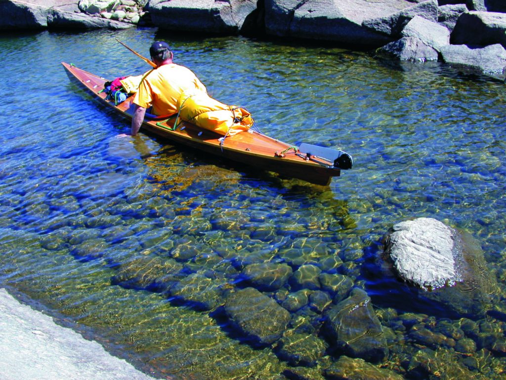 Somewhere in the Fox Islands chain in Georgian Bay. Submerged rocks below crystal clear water make a great backdrop for this 17’ Endeavor kayak. Another great reason why people build boats.