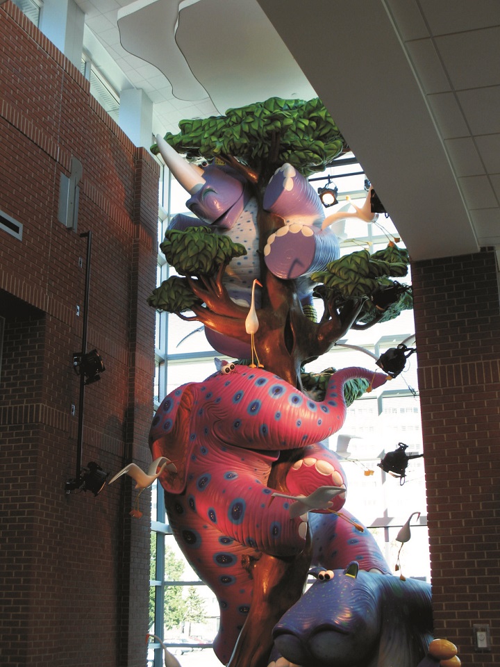 Upper half of a 30'-tall hippo, elephant, rhino sculpture made of foam, epoxy, fiberglass and steel for the Brookdale Public Library, Brooklyn Center Minnesota.