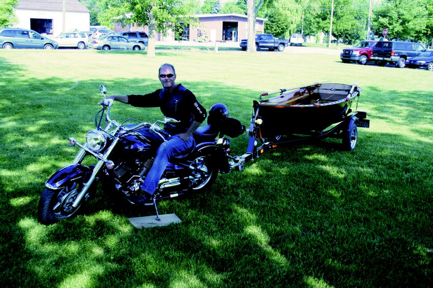 The lightweight Arch Davis Sand Dollar and its trailer tow easily behind a motorcycle.