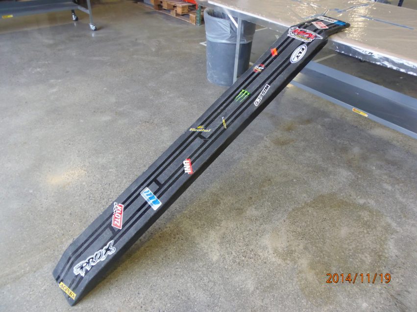 The finished dirt bike loading ramp is complete with non-skid coating and stickers.