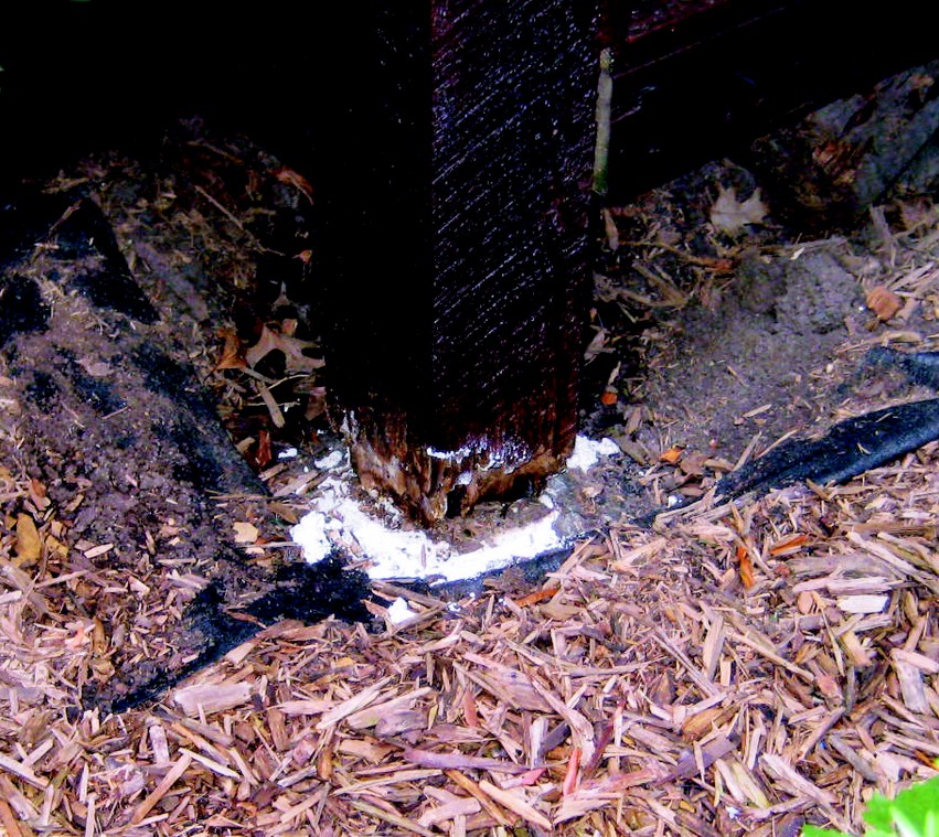 soil held moisture against the bottom of the deck post.