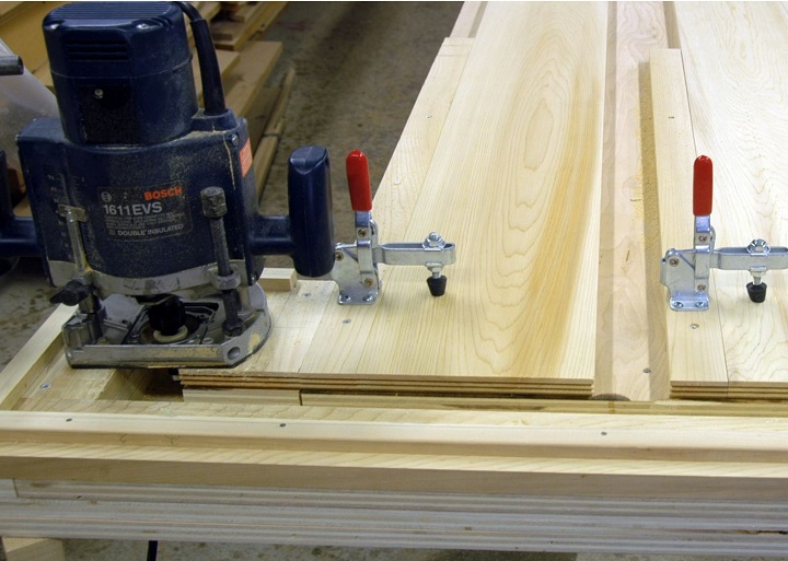 To machine the joint, we built a simple router setup that would shape the ends of two boards in one pass. One board is flipped over to fit the ends together.