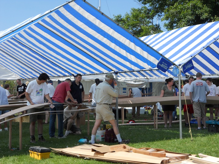 Tents provided much-needed shade for the families participating in the Family Build Weekend, and the CLC and Gougeon advisors as the canoes begin to take shape.