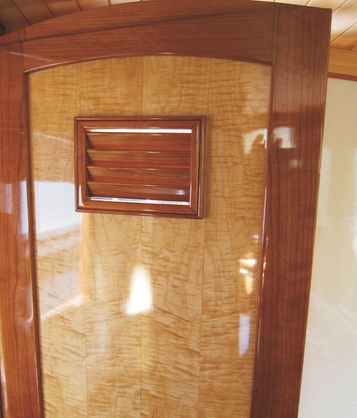 Ted also used Cherry to trim the book-matched curly maple door to the head.