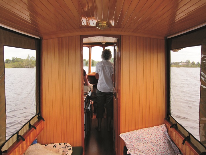 Looking forward, the cabin/pilot house contains a berth under the deck, a galley, head and the steering station.