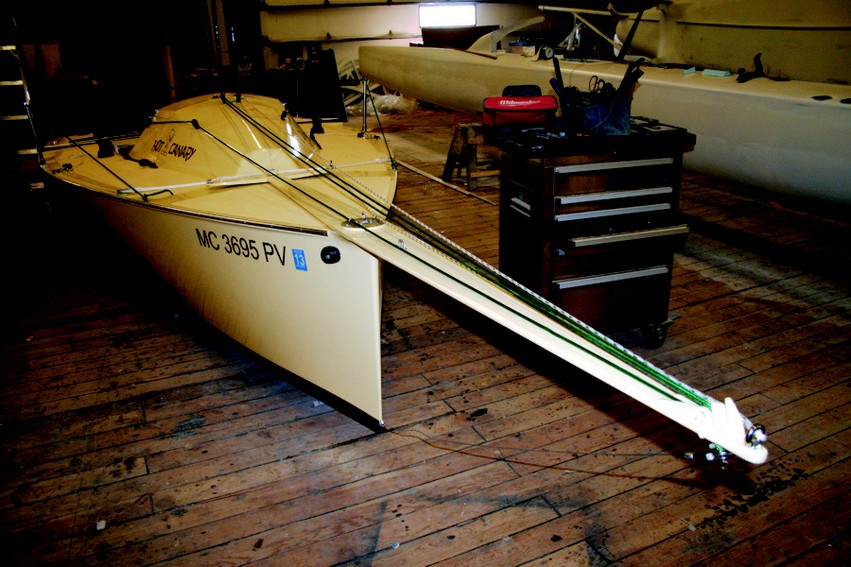 The bowsprit of the i550 sportboat is hinged at the bow and attached to a crossed line at the base of the cockpit which will allow it to pivot 30 degrees.