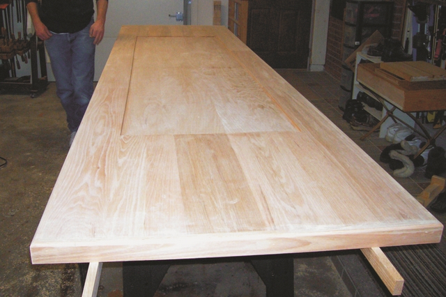 The oak bar top ready for a sealer coat of 105/207 Epoxy. Note the recessed center where the epoxy pour will go, encapsulating the memorabilia.