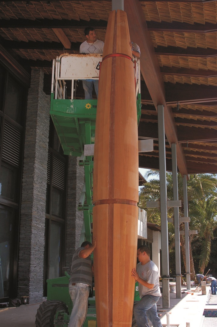 Two halves of one of the rear architectural columns being installed over inner steel support columns. The installed columns were stained and finished in place. Brass flat stock was installed in the reveals for added detail.