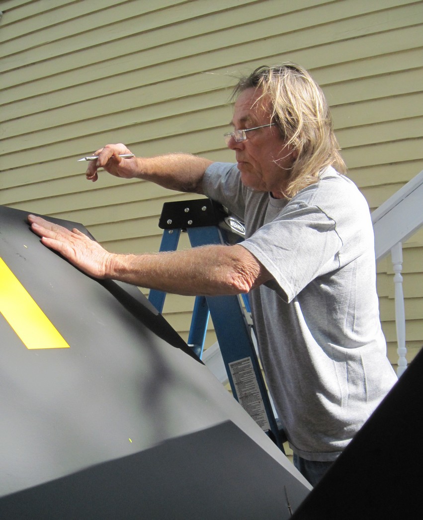 Sculptor Bill Wood working on High Road