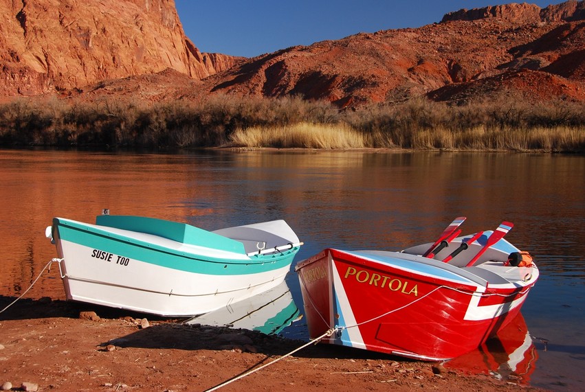 The wooden dories SUSIE TOO and PORTOLA tied up at a quiet spot on the Colorado River