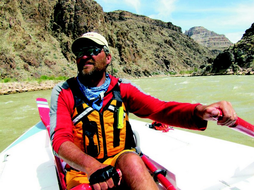 Hatten keeps his eyes open for the next rapids on a trip down the Colorado.