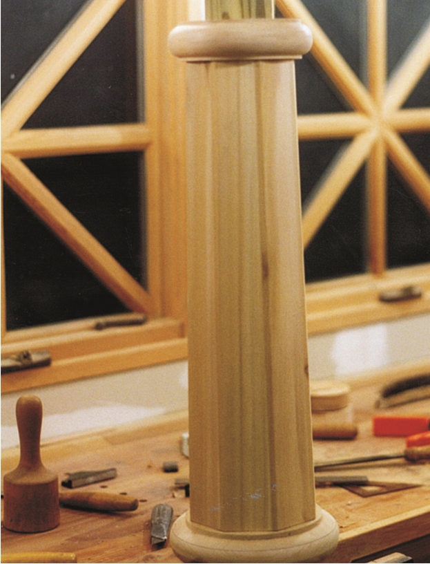 Turned collars provide a base and separate upper and lower sections of the custom lantern post.