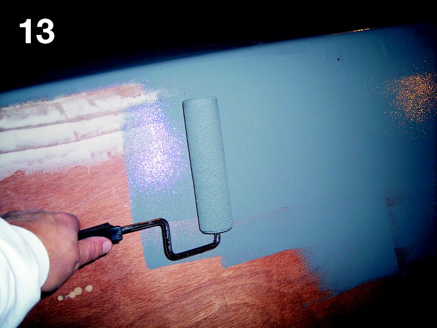 Coating the hull of the skiff with WEST SYSTEM 105/207 tinted with 503 Gray Pigment.