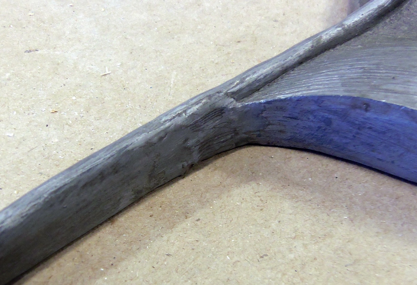 Enlargement of the wall plaque's repaired section.
