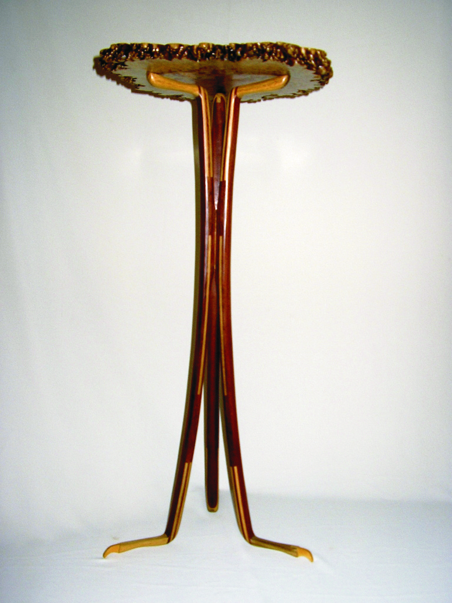 David Cumming's Amboyna Burl Top Stand, 2007—Amboyna top with Cumaru and Black Locust Laminated legs with Pau Amarillo “claw” feet.