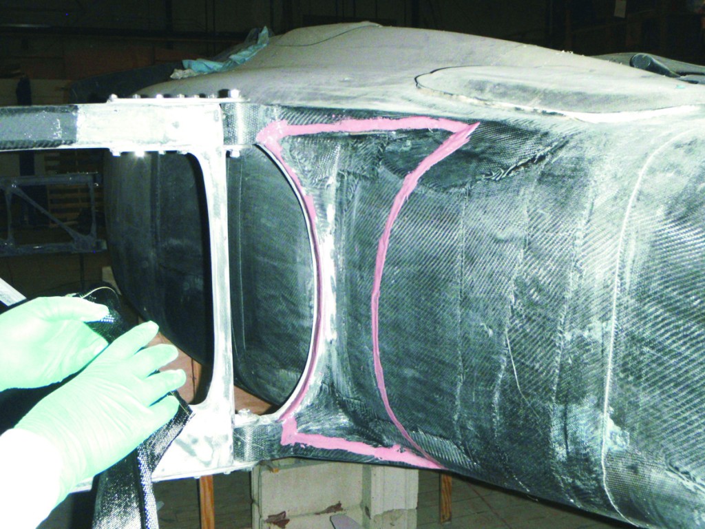 In Jan's fairing technique, a faster-setting epoxy concoction is applied with an 804 Glue Brush following the guideline pattern previously established.