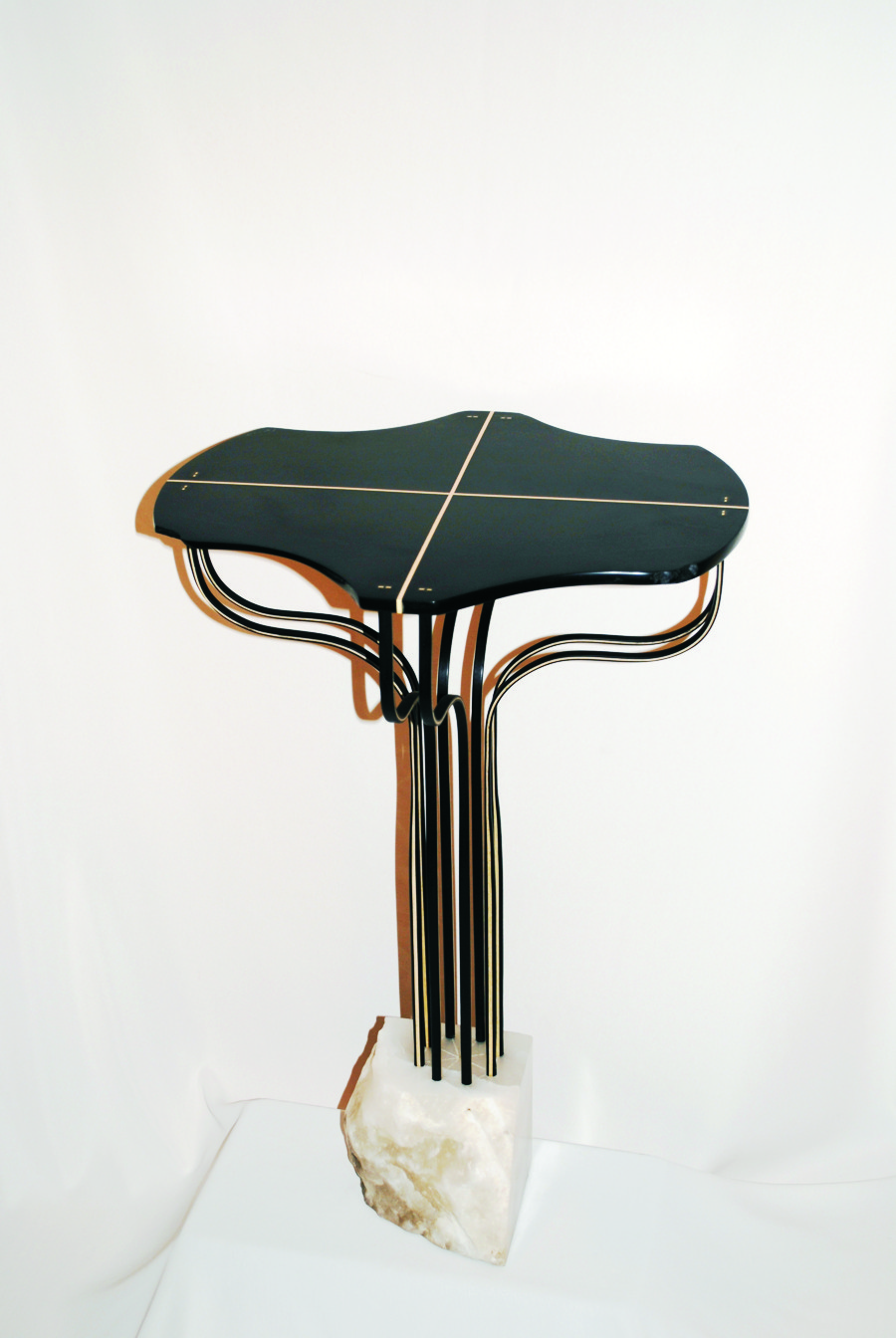Stand No. 1, 2010—The Holly and Ebony legs to this piece were glued with WEST SYSTEM Epoxy. The Black Chlorite and Holly top was also glued with WEST SYSTEM Epoxy. The base is Italian White Alabaster.