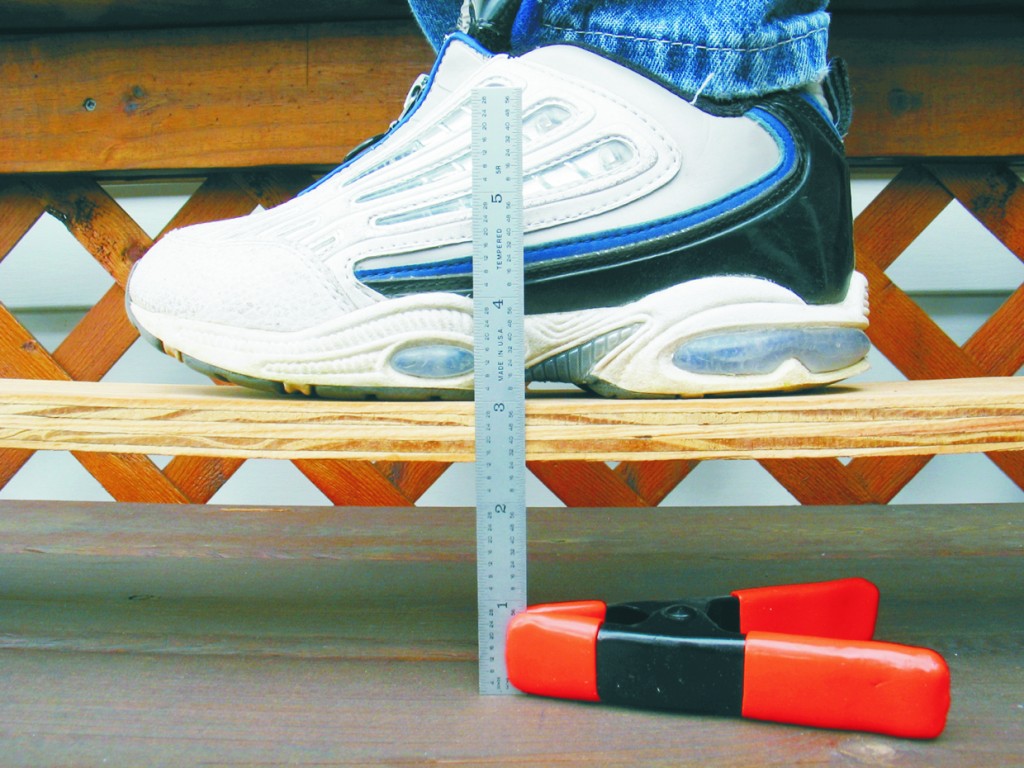 Close up views of the test apparatus and chronological sequence of the test. 1. With no load, the top of the unreinforced board measures exactly 3½" above ground zero.