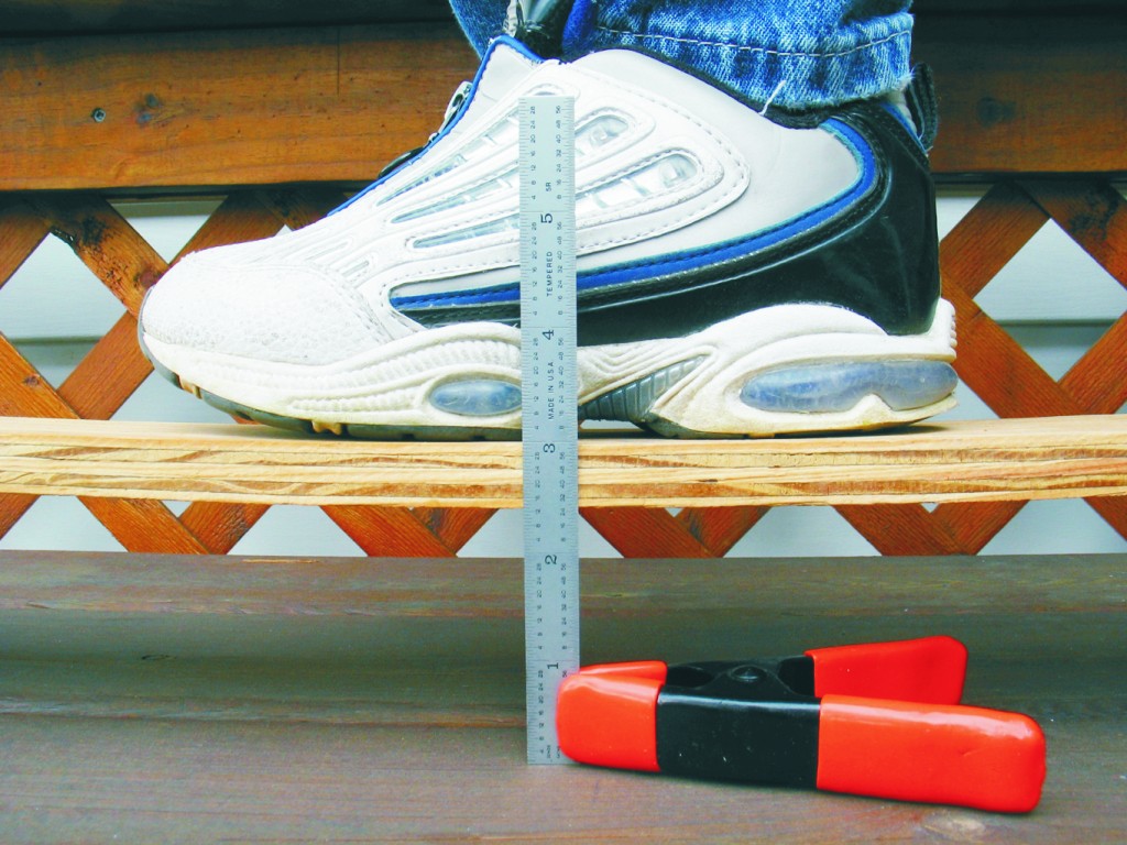 Initial bending of the unreinforced board with a load of 1 Mikayla. The camera recorded flexure of ½" at the board’s center.