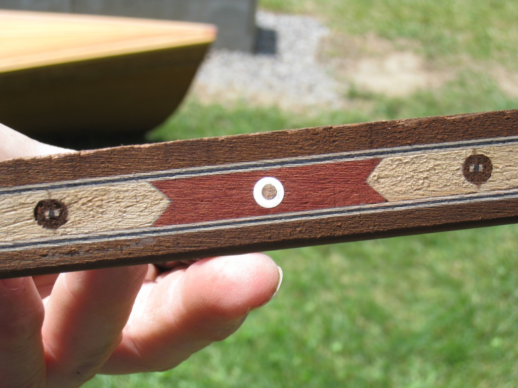 Sections of clear polycarbonate tubing embedded in some accent strips available from Canadian Canoes glow as light shines through from the backside.