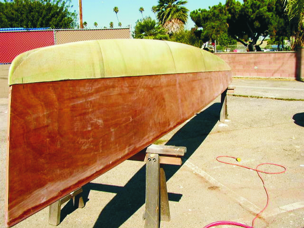 Figure 3—The epoxy/fiberglass composite pan is glued to the topsides. Fairing is required only along the joint before the outside of the float is glassed and coated with epoxy.