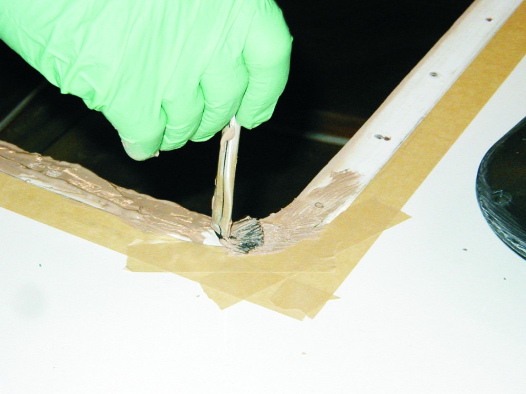 4—Brush a 4–5 mil coating of thickened epoxy to the deck around the perimeter of the opening.