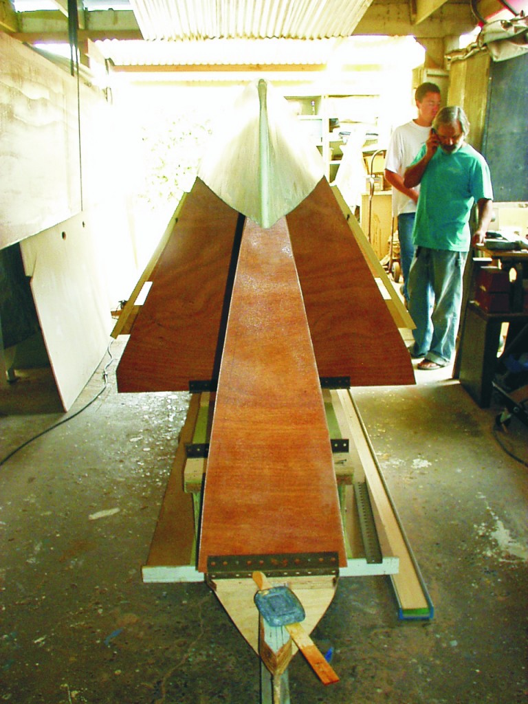 Figure 4—The main hull is built by first attaching bulkheads to a strongback. Here, the pan is glued to the bulkheads before butt blocks are glued to the pan. The topsides are put on last.